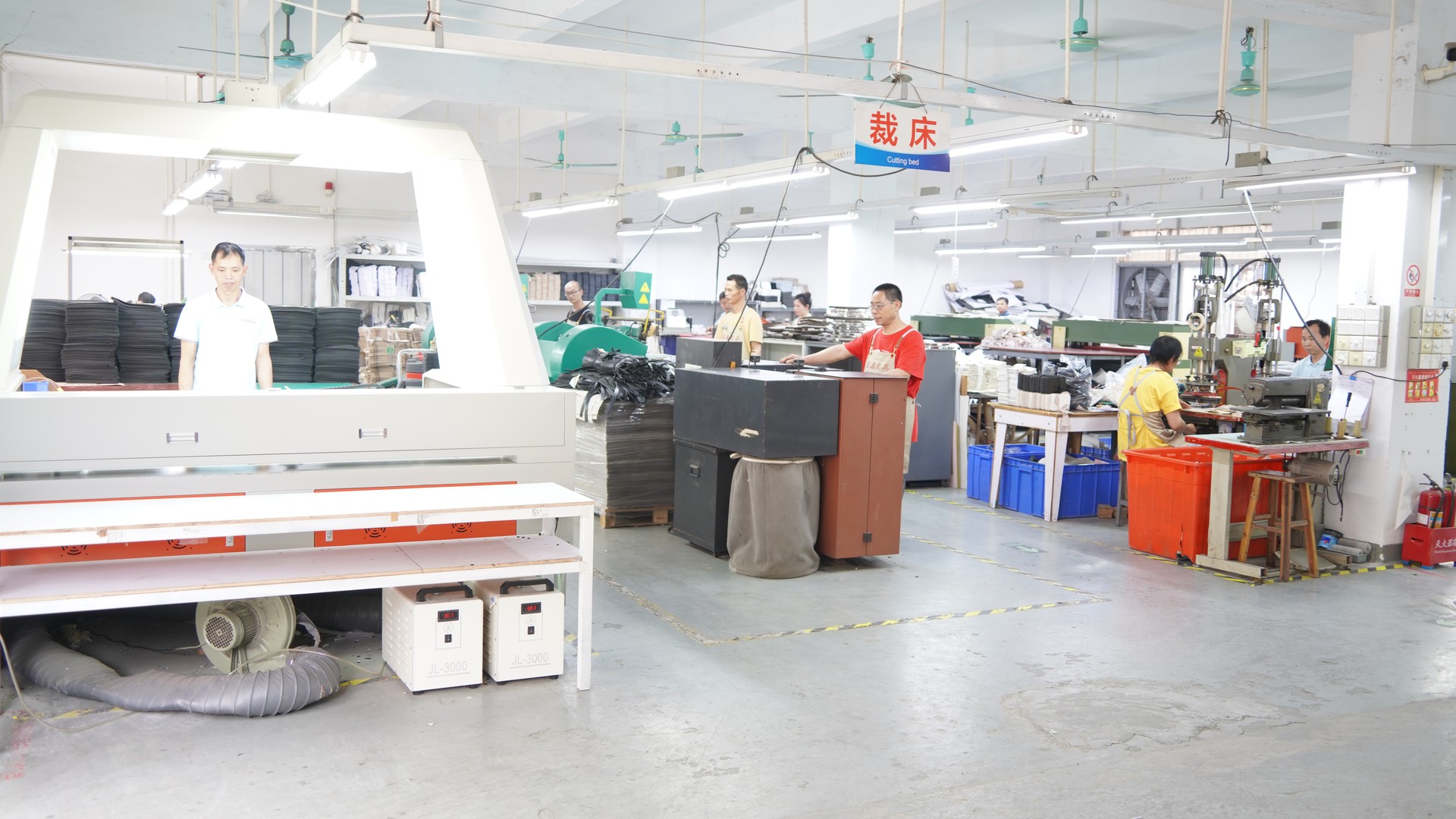 Premium full-grain leather rolls and eco-friendly vegan leather swatches in factory workshop